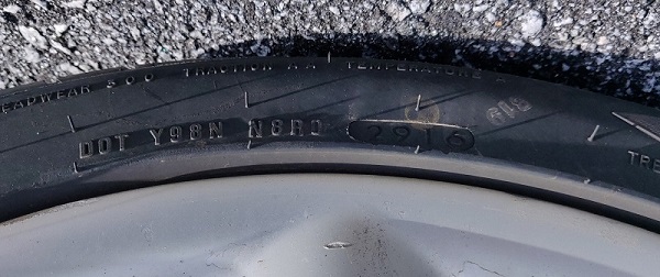 Tire bearing the DOT code Y98N N8R0 2916